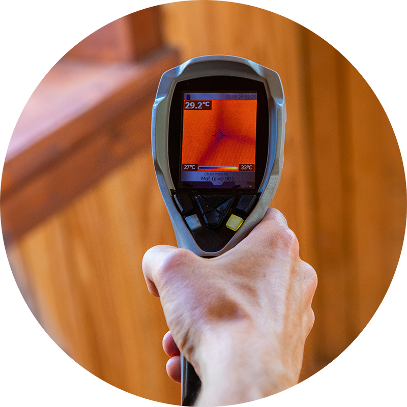 Thermal imaging device being used during a home inspection